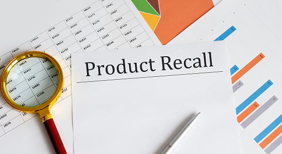 product recall form with magnifying glass for defective products