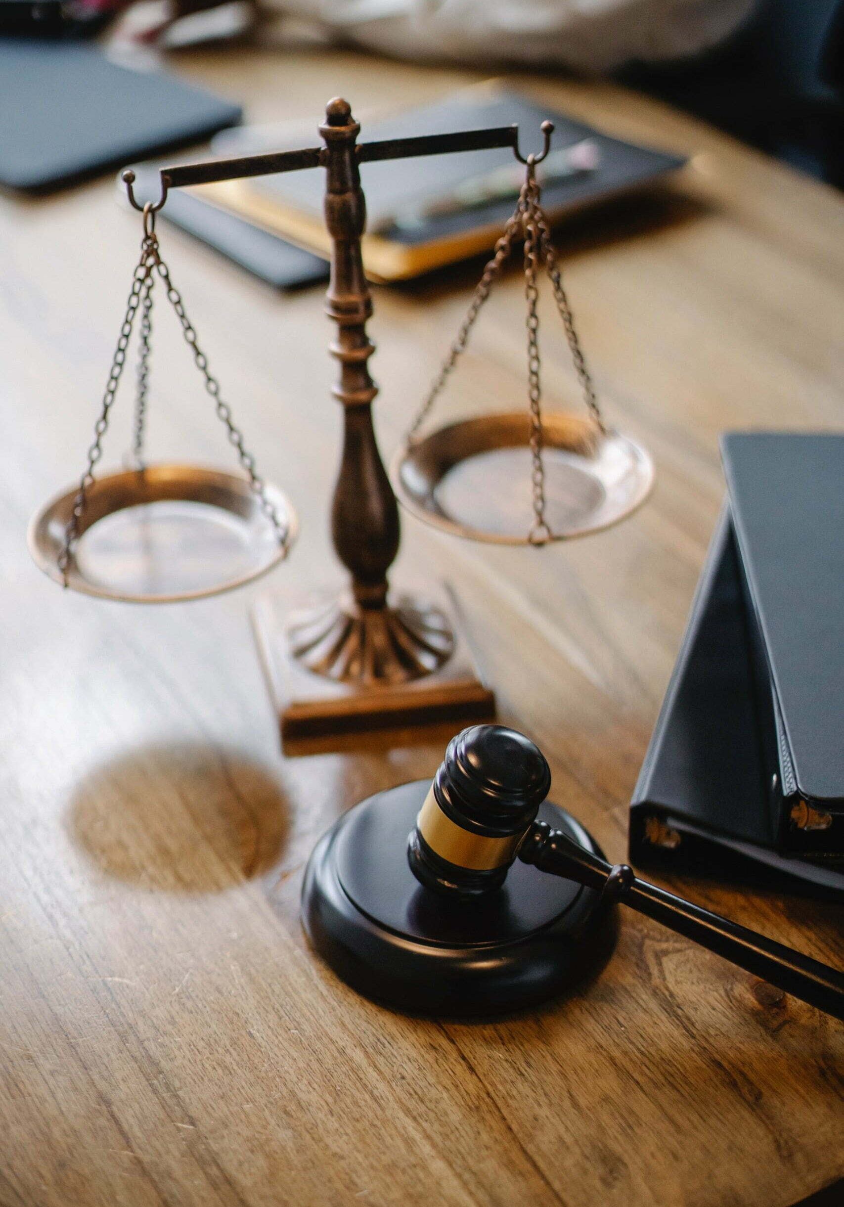 gavel and scale on desk in law office of sexual abuse case.