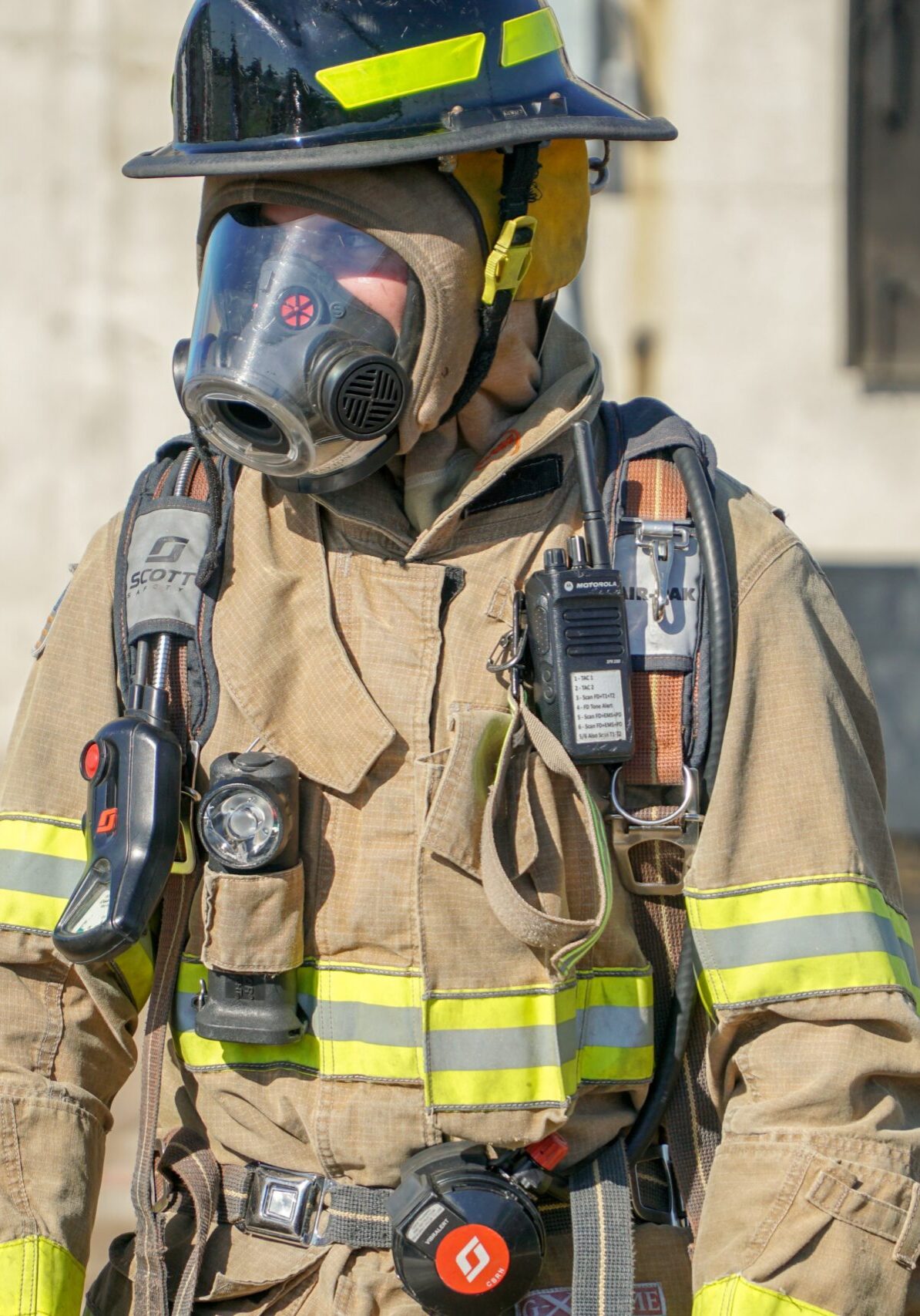 NYC firefighter with mask on to protect against toxic fumes